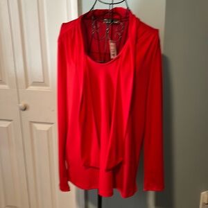 New with tags nice red long sleeve blouse.